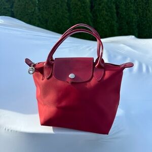 Longchamp Mini Red Nylon Top Handle Bag.